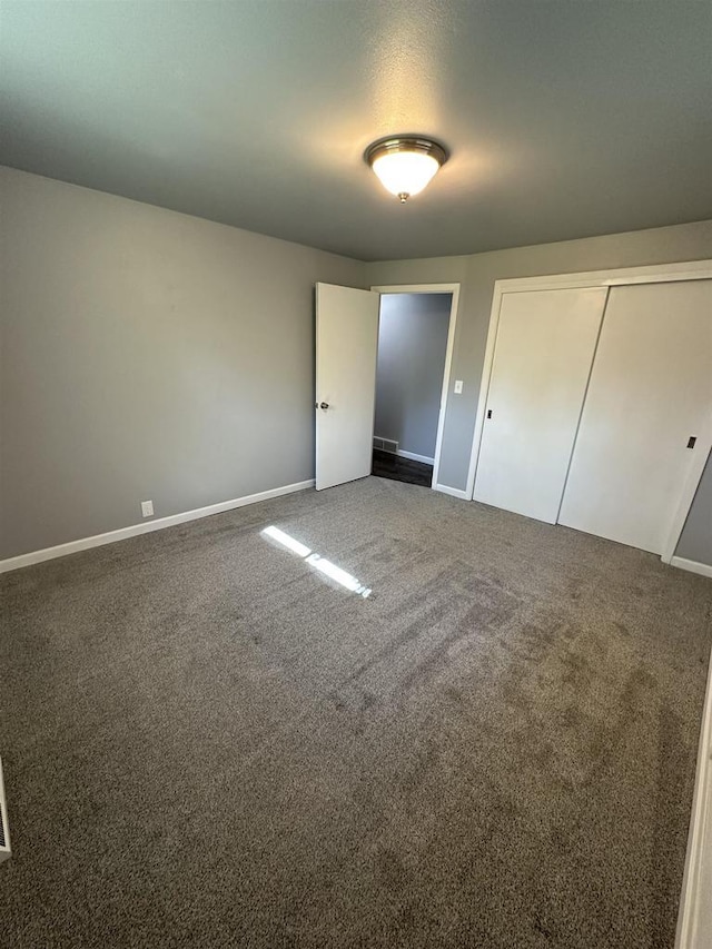 174 Mckinley Ave, Clintonville, WI 54929 - unfurnished bedroom with baseboards, carpet flooring, and a closet
