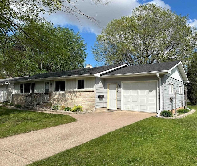 174 Mckinley Ave, Clintonville, WI 54929 - single story home featuring an attached garage, a front yard, driveway, and brick siding