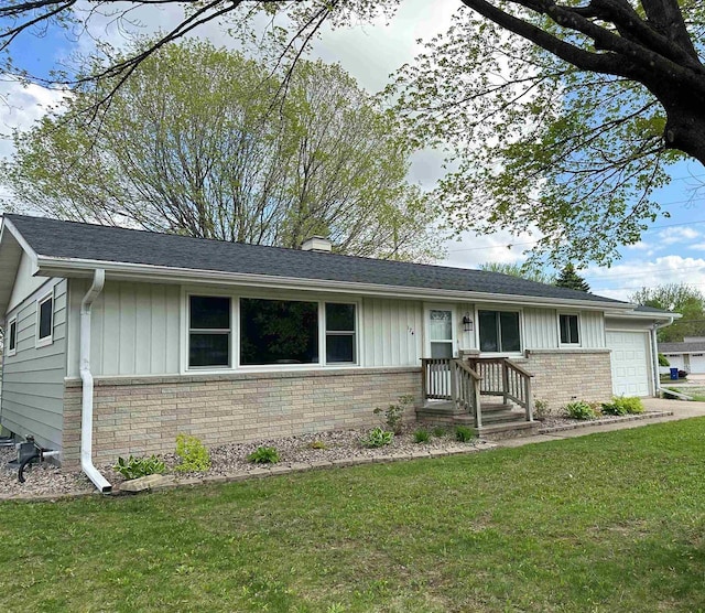 174 Mckinley Ave, Clintonville, WI 54929 - single story home featuring brick siding, a garage, a front yard, and board and batten siding