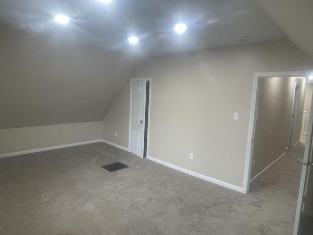 3122 W Madison St, Milwaukee, WI 53215 - additional living space featuring vaulted ceiling, carpet floors, baseboards, and recessed lighting