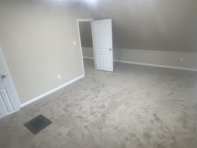 3122 W Madison St, Milwaukee, WI 53215 - additional living space with lofted ceiling, carpet, and baseboards