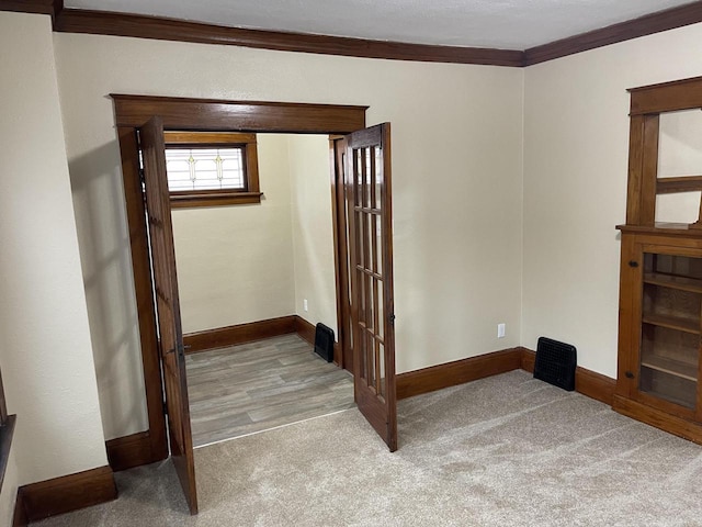 3122 W Madison St, Milwaukee, WI 53215 - spare room featuring carpet floors, baseboards, and crown molding