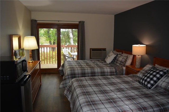 15326 W Birch Point Rd, Hayward, WI 54843 - bedroom featuring dark wood-type flooring and a wall mounted AC