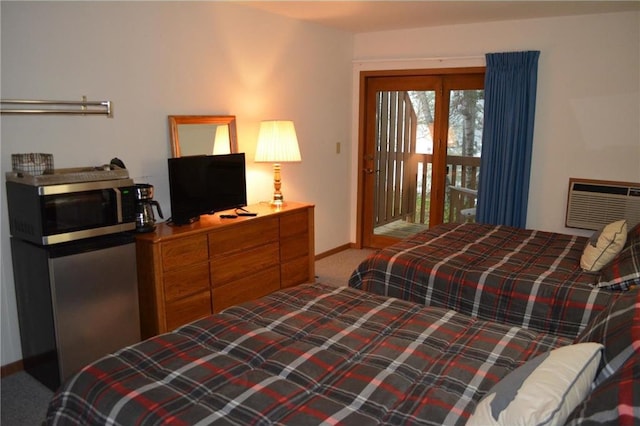 15326 W Birch Point Rd, Hayward, WI 54843 - carpeted bedroom featuring baseboards, a wall unit AC, and access to outside