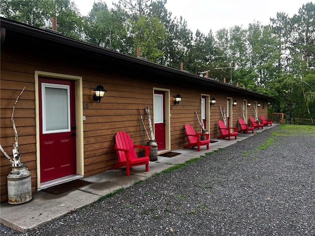 15326 W Birch Point Rd, Hayward, WI 54843 - rear view of house featuring view of wooded area