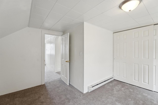 815 Madison St, Little Chute, WI 54140 - unfurnished bedroom with a baseboard heating unit, carpet floors, a closet, and vaulted ceiling