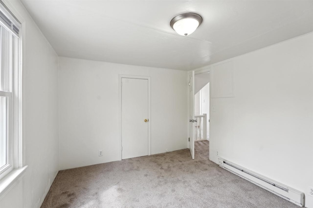 815 Madison St, Little Chute, WI 54140 - unfurnished bedroom featuring baseboard heating and carpet floors