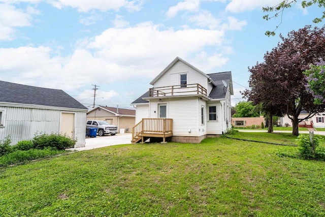 815 Madison St, Little Chute, WI 54140 - rear view of house with a lawn, a balcony, roof with shingles, and concrete driveway