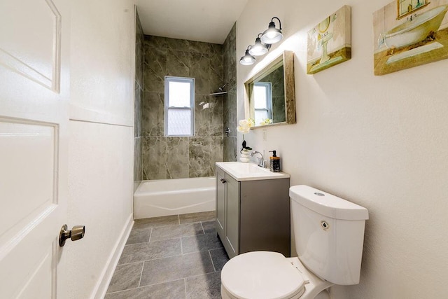 1516 Blake Ave, Racine, WI 53404 - bathroom with toilet, vanity, bathing tub / shower combination, baseboards, and stone finish floors