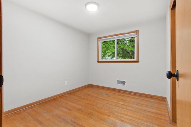 823 Sunny Ln, Green Bay, WI 54304 - unfurnished room with baseboards and light wood-style flooring