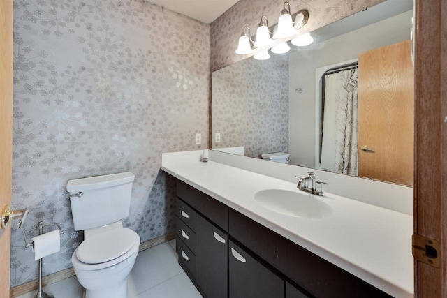 69 Ponwood Cir, Madison, WI 53717 - bathroom featuring toilet, vanity, wallpapered walls, tile patterned flooring, and baseboards