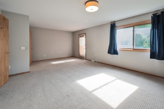 69 Ponwood Cir, Madison, WI 53717 - carpeted spare room featuring healthy amount of natural light and baseboards