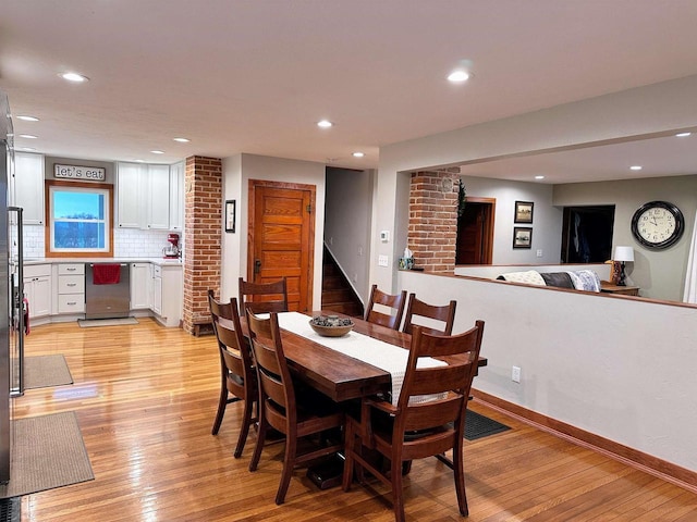 11691 County Road P, Bagley, WI 53801 - dining space featuring light wood-type flooring, stairs, and recessed lighting
