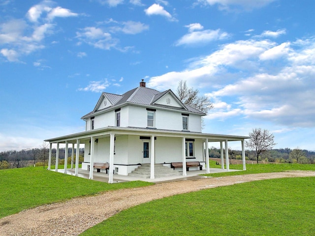 11691 County Road P, Bagley, WI 53801 - view of front facade featuring a front lawn, driveway, a patio area, and a chimney