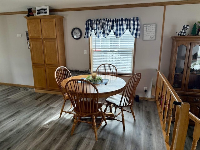 33150 Donna Dr, Prairie Du Chien, WI 53821 - dining space featuring light wood-style flooring, crown molding, and baseboards