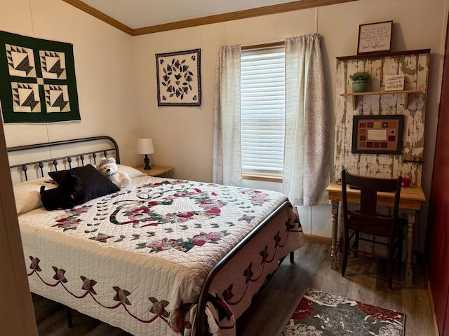 33150 Donna Dr, Prairie Du Chien, WI 53821 - bedroom featuring wood finished floors and crown molding
