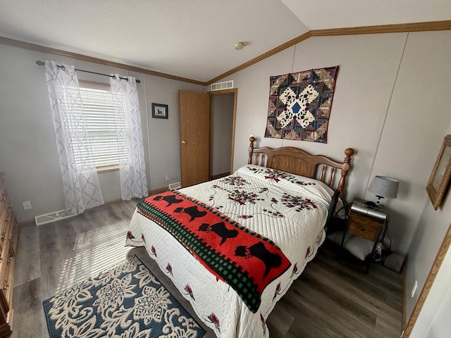 33150 Donna Dr, Prairie Du Chien, WI 53821 - bedroom with wood finished floors, lofted ceiling, and crown molding