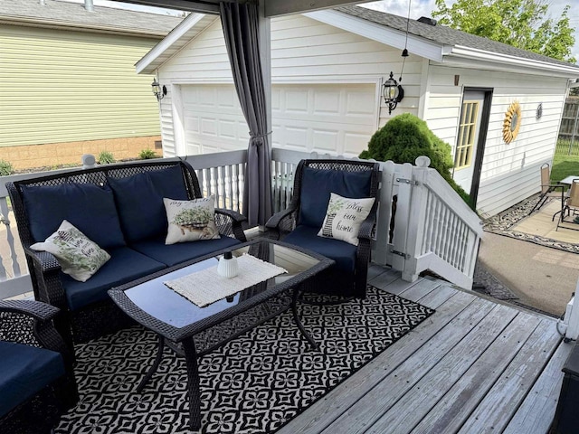 33150 Donna Dr, Prairie Du Chien, WI 53821 - wooden terrace with outdoor lounge area and a garage