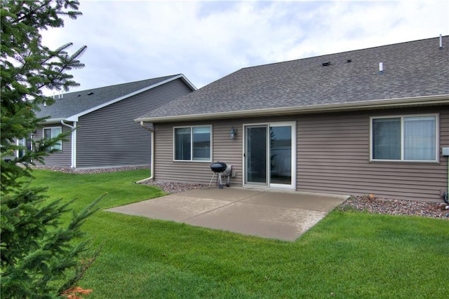 5631 Green Park Dr, Eau Claire, WI 54703 - rear view of house featuring a patio, a shingled roof, and a yard