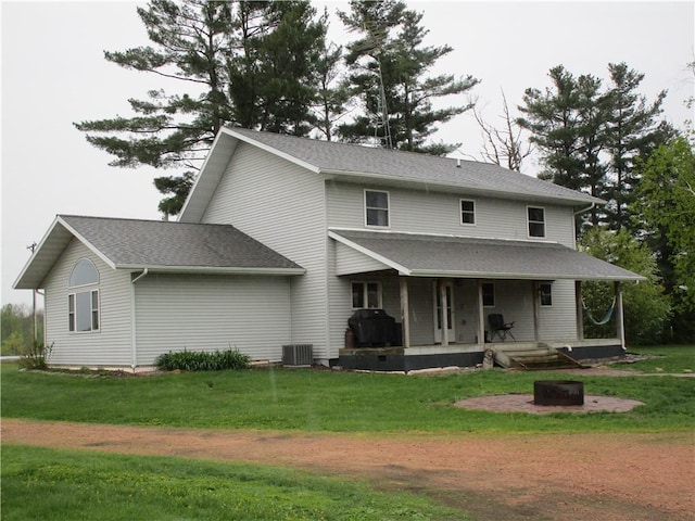 W12058 US Highway 8, Bruce, WI 54819 - rear view of property featuring a porch, central air condition unit, and a lawn