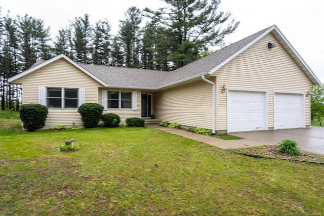 24301 Dexter Ave, Tomah, WI 54660 - ranch-style home with an attached garage, concrete driveway, a front lawn, and roof with shingles