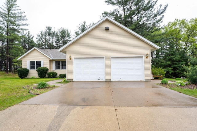 24301 Dexter Ave, Tomah, WI 54660 - view of front of property with a garage and a front lawn