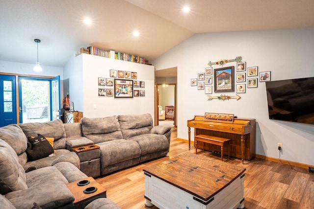 24301 Dexter Ave, Tomah, WI 54660 - living area featuring lofted ceiling, light wood-type flooring, recessed lighting, and baseboards