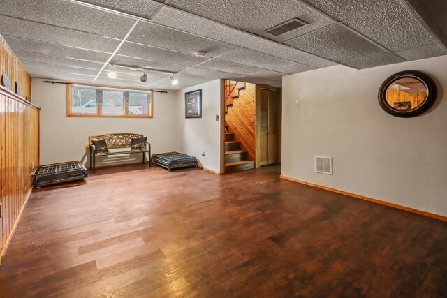 N11278 Kaufman Rd, Tomahawk, WI 54487 - basement with wood finished floors, stairway, track lighting, and baseboards