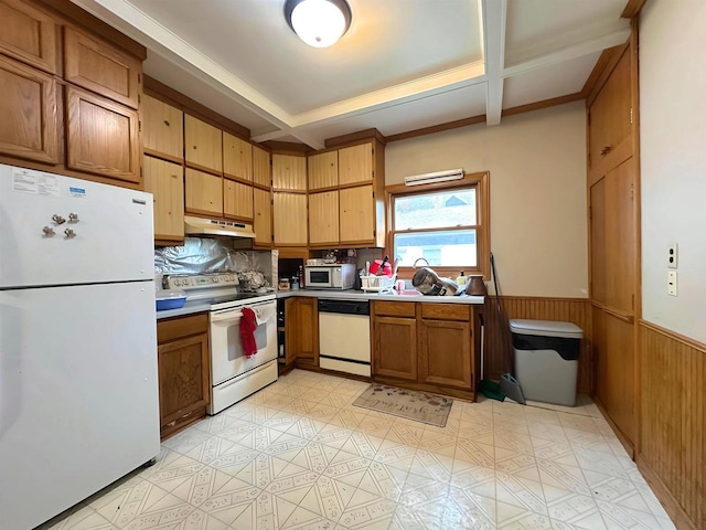 1340 Liberty St, Oshkosh, WI 54901 - kitchen featuring white appliances, under cabinet range hood, a wainscoted wall, beamed ceiling, and brown cabinets