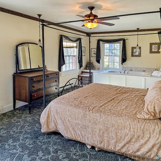 933 Nebraska Row, La Pointe, WI 54850 - bedroom with carpet floors, ornamental molding, multiple windows, and baseboards