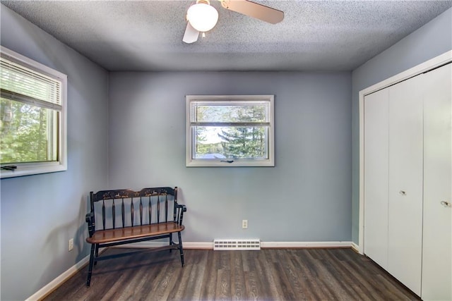 12272 Ewig Rd, Hayward, WI 54843 - living area with wood finished floors, ceiling fan, a textured ceiling, and baseboards