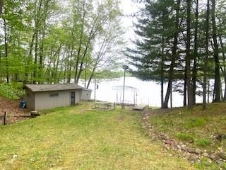 12272 Ewig Rd, Hayward, WI 54843 - view of grassy yard featuring a water view and an outdoor structure