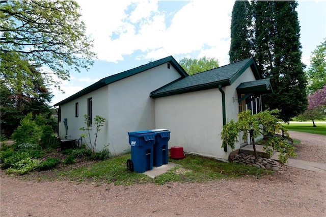 915 W Knapp St, Rice Lake, WI 54868 - view of home's exterior with stucco siding