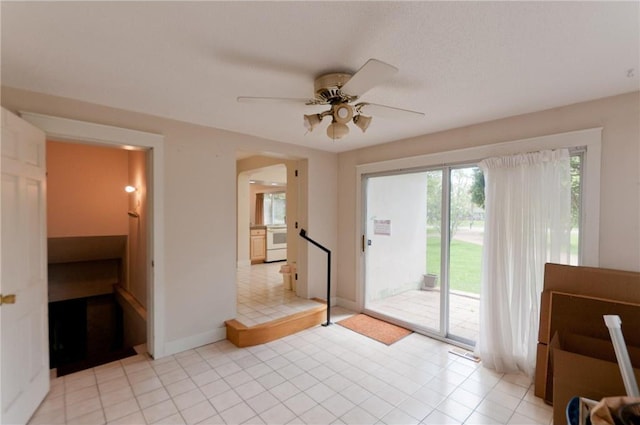 915 W Knapp St, Rice Lake, WI 54868 - interior space featuring ceiling fan, light tile patterned floors, and baseboards
