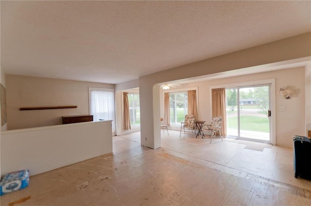 915 W Knapp St, Rice Lake, WI 54868 - unfurnished living room with a textured ceiling