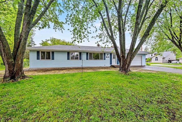 2407 Barbara Ave, Appleton, WI 54915 - ranch-style house with asphalt driveway, an attached garage, and a front lawn