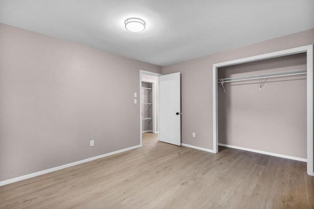 2407 Barbara Ave, Appleton, WI 54915 - unfurnished bedroom featuring wood finished floors, baseboards, and a closet