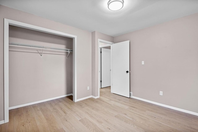 2407 Barbara Ave, Appleton, WI 54915 - unfurnished bedroom with wood finished floors, baseboards, and a closet