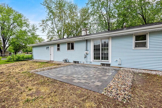 2407 Barbara Ave, Appleton, WI 54915 - rear view of house featuring a patio and a chimney