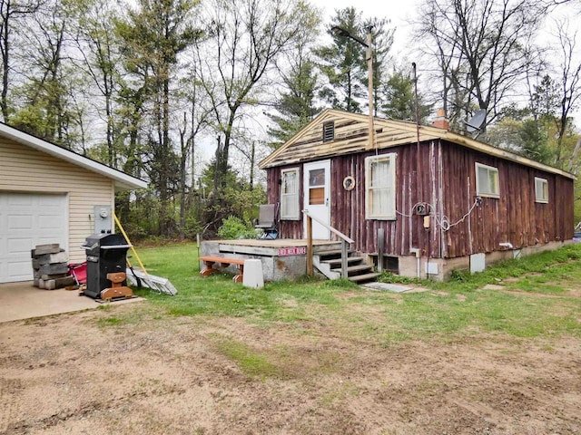 W8666 County Rd K, Elcho, WI 54428 - view of outbuilding featuring a garage and driveway