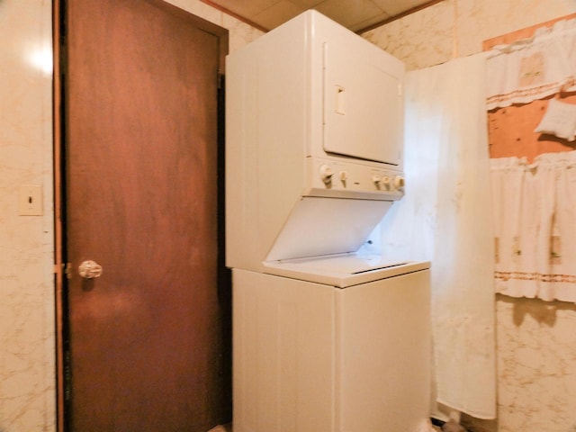 W8666 County Rd K, Elcho, WI 54428 - washroom with stacked washer and clothes dryer