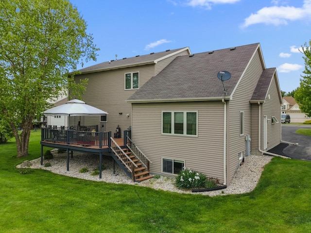 W4748 Ridgeview Rd, Elkhorn, WI 53121 - back of property with a gazebo, a lawn, a deck, and a shingled roof