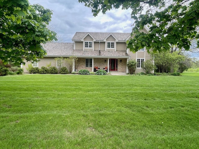 11616 N Lantern Ln, Mequon, WI 53092 - traditional-style home with a front yard, brick siding, and a porch