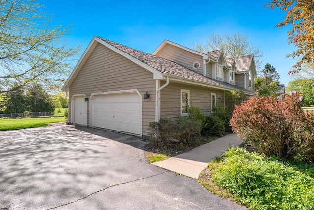 11616 N Lantern Ln, Mequon, WI 53092 - view of side of home with driveway and a garage