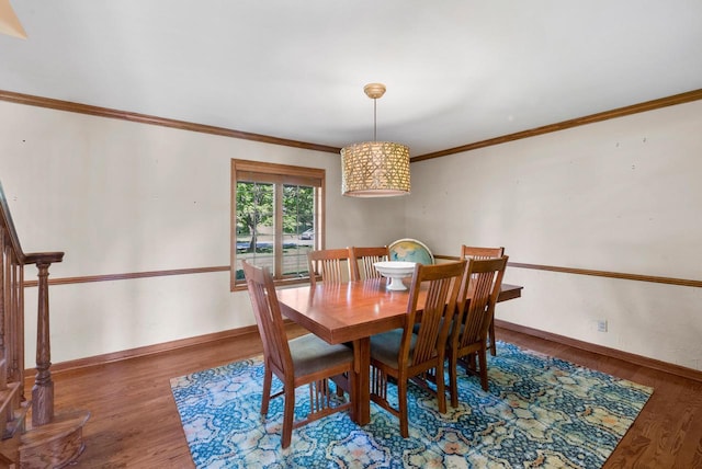 11616 N Lantern Ln, Mequon, WI 53092 - dining room with wood finished floors, baseboards, and ornamental molding