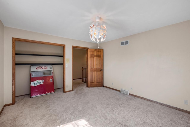 11616 N Lantern Ln, Mequon, WI 53092 - unfurnished bedroom featuring a chandelier, carpet floors, and baseboards