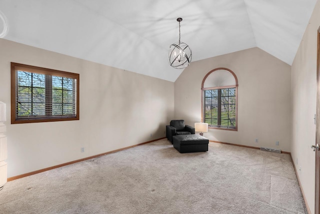11616 N Lantern Ln, Mequon, WI 53092 - unfurnished room with plenty of natural light, carpet, vaulted ceiling, a chandelier, and baseboards
