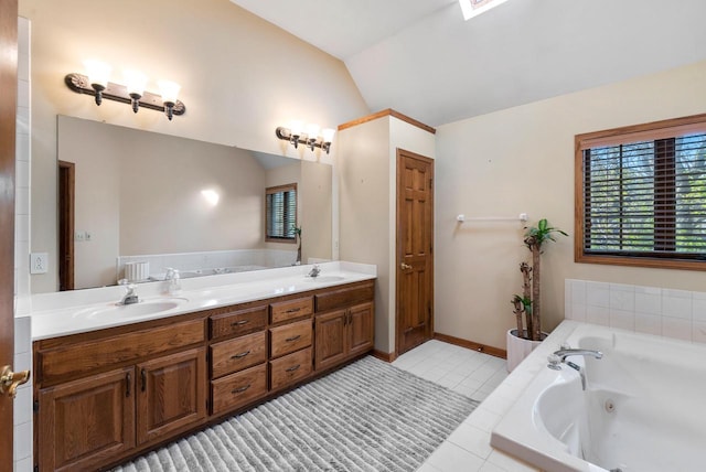 11616 N Lantern Ln, Mequon, WI 53092 - bathroom featuring lofted ceiling, double vanity, a whirlpool tub, and tile patterned floors