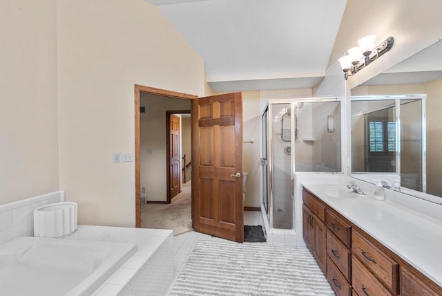11616 N Lantern Ln, Mequon, WI 53092 - full bathroom featuring vaulted ceiling, vanity, a stall shower, and a garden tub