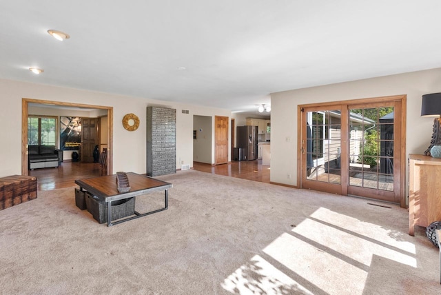 11616 N Lantern Ln, Mequon, WI 53092 - unfurnished living room with carpet flooring and plenty of natural light